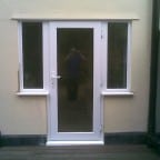 White uPVC door with 2 side windows