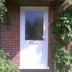 White uPVC front door with white furniture