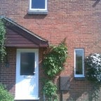 White uPVC front door with white furniture