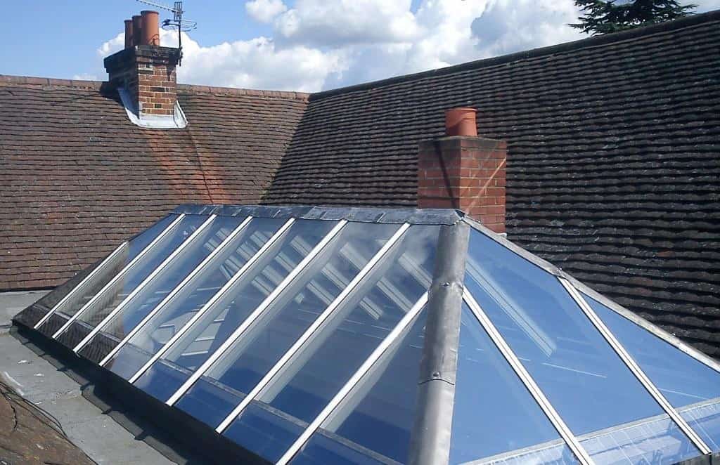 Timber lantern roof lights with aluminium top caps and clear glass by Dorking Glass