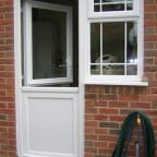 White uPVC half stable door and side window with Georgian Bars