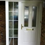 White GRP Composite front door with a white uPVC outerframe, sidelight with 18mm internal Georgian Bars, and gold colour furniture