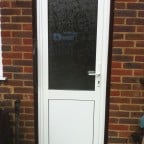 White uPVC back door with obscure glass