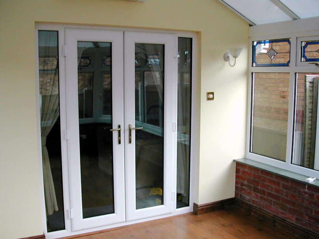 White uPVC French Doors with two full length side windows