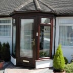 Rosewood uPVC porch with gold furniture
