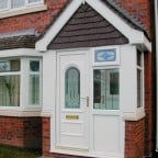 White uPVC porch with decorative front door glass
