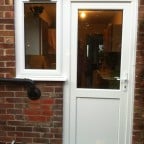 White uPVC back door with side window