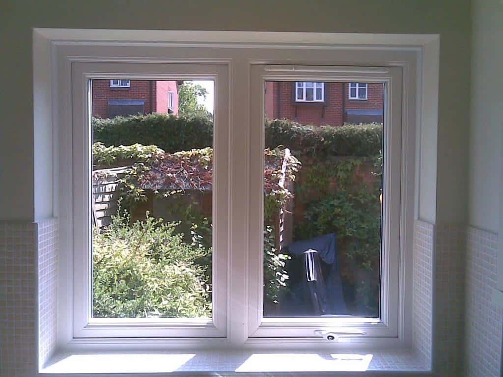 White uPVC window with a dummy casement for equal sight lines and a 4000 trickle vent in the