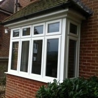White uPVC window with chamfered framing and dummy casements for equal sight lines
