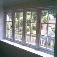 White uPVC Bay Window with surface mounted Georgian Bars, chamfered framing and dummy casements