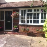 White uPVC Bay Window with surface mounted Georgian Bars, chamfered framing