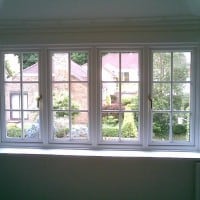 White uPVC Bay Window with surface mounted Georgian Bars, chamfered framing and dummy casements