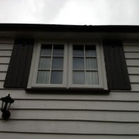 A-rated White uPVC window with fully sculptured framing, surface mounted Georgian Bars and black antique style monkeytail handles