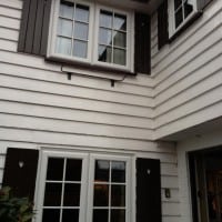 A-rated White uPVC windows with fully sculptured framing, surface mounted Georgian Bars and black antique style monkeytail handles