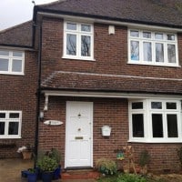 White woodgrain A-rated uPVC window. Liniar fully sculptured framing with dummy casements for equal sight lines