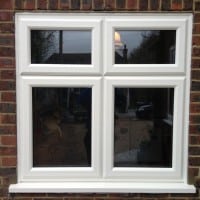 White woodgrain A-rated uPVC window. Liniar fully sculptured framing with dummy casements for equal sight lines