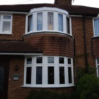 Externally glazed white uPVC Swiftframe profile chamfered framing windows with dummy casements for equal sight lines