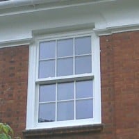 uPVC vertical sliding window with surface mounted Georgian Bars