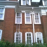 uPVC vertical sliding window with surface mounted Georgian Bars