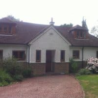 Light Oak uPVC windows with chamfered framing and dummy casements for equal sight lines