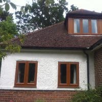 Light Oak uPVC windows with chamfered framing and dummy casements for equal sight lines