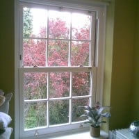 uPVC vertical sliding window with surface mounted Georgian Bars