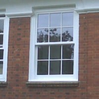 uPVC vertical sliding window with surface mounted Georgian Bars