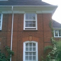 uPVC vertical sliding window with surface mounted Georgian Bars