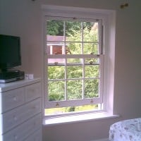 uPVC vertical sliding window with surface mounted Georgian Bars
