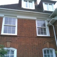 uPVC vertical sliding window with surface mounted Georgian Bars