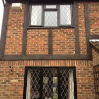 Brown Black A-rated uPVC windows with 9mm diamond leaded lights