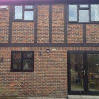 Brown Black A-rated uPVC windows with 9mm diamond leaded lights