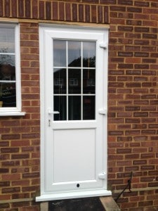 White Liniar profile uPVC back door - bevelled beading and framing. 18mm internal Georgian bars with clear glass