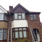 Rosewood colour uPVC fascias, soffits and cladding with black uPVC guttering and downpipes