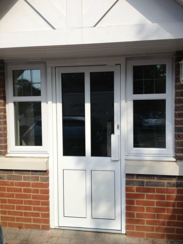 White powder coated commercial aluminium framing with clear toughened double glazed door