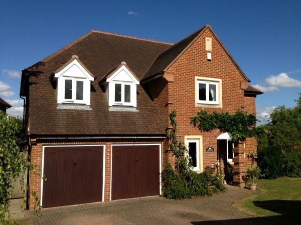 White uPVC fascia and soffits. Black round guttering.