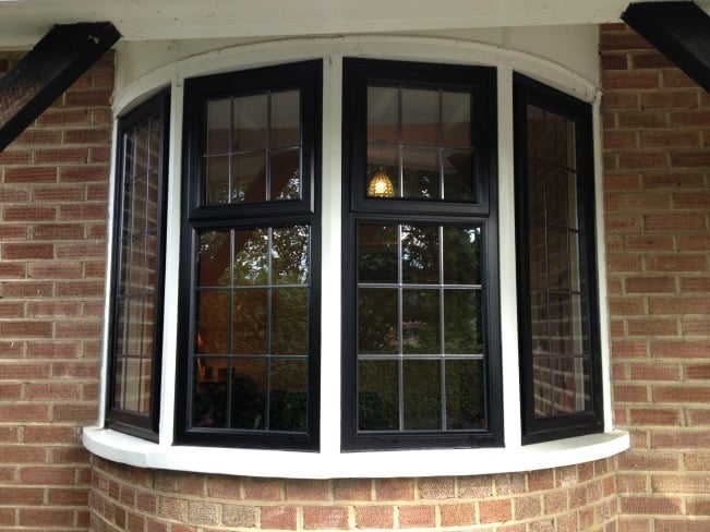 Black out / White in thermally broken powder coated aluminium window inserts installed within the existing timber sub-frames. 