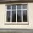 White powder-coated aluminium windows with clear toughened glass