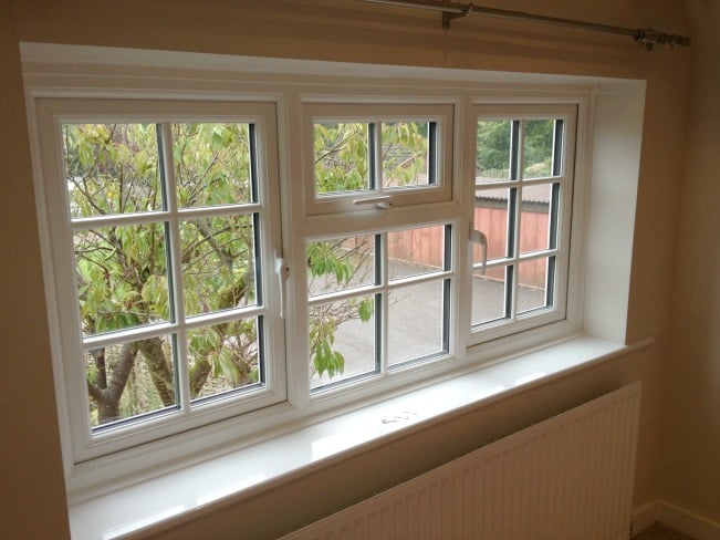 White uPVC Liniar profile with surface mounted Georgian Bars.
