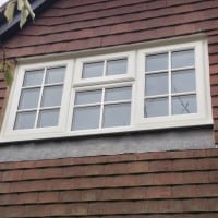 White uPVC Liniar profile with surface mounted Georgian Bars.