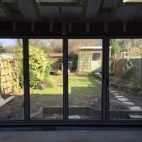 double-glazed-anthracite-grey-aluminium-bifolding-doors-by-dorking-glass-2