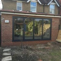 double-glazed-anthracite-grey-aluminium-bifolding-doors-by-dorking-glass